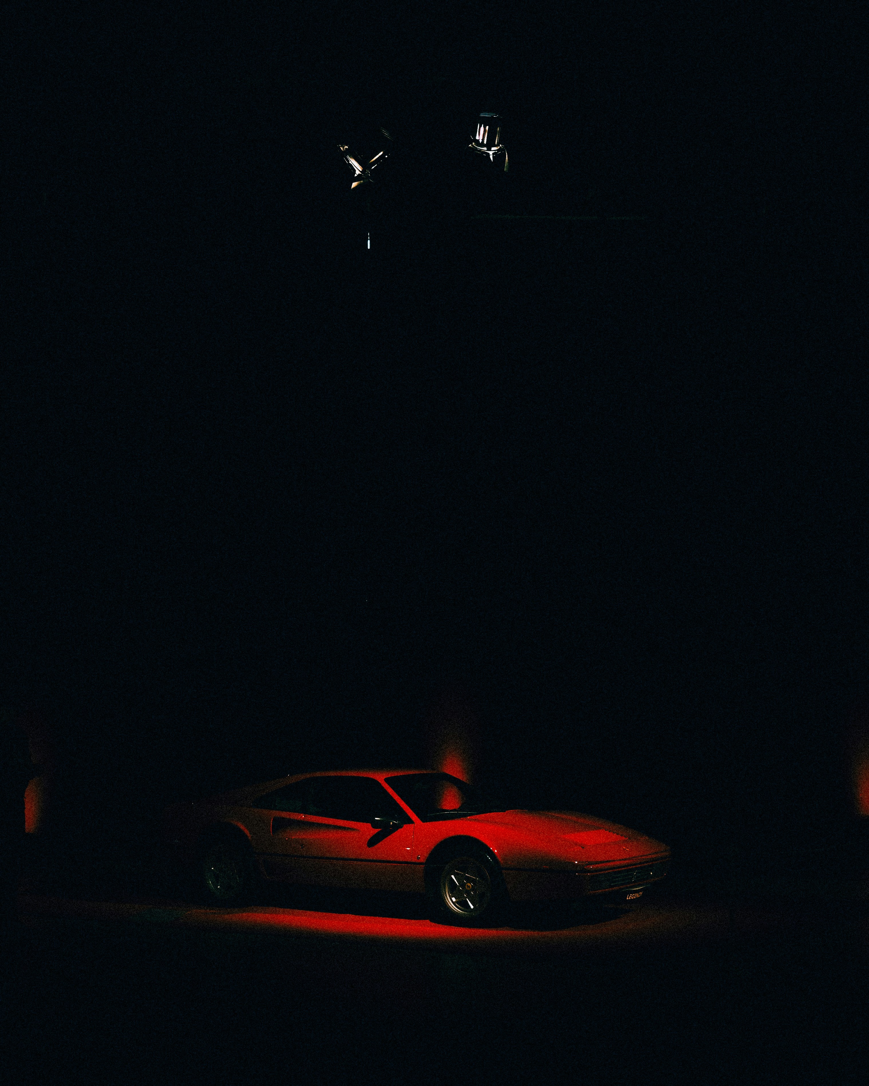 Ferrari in dark showroom