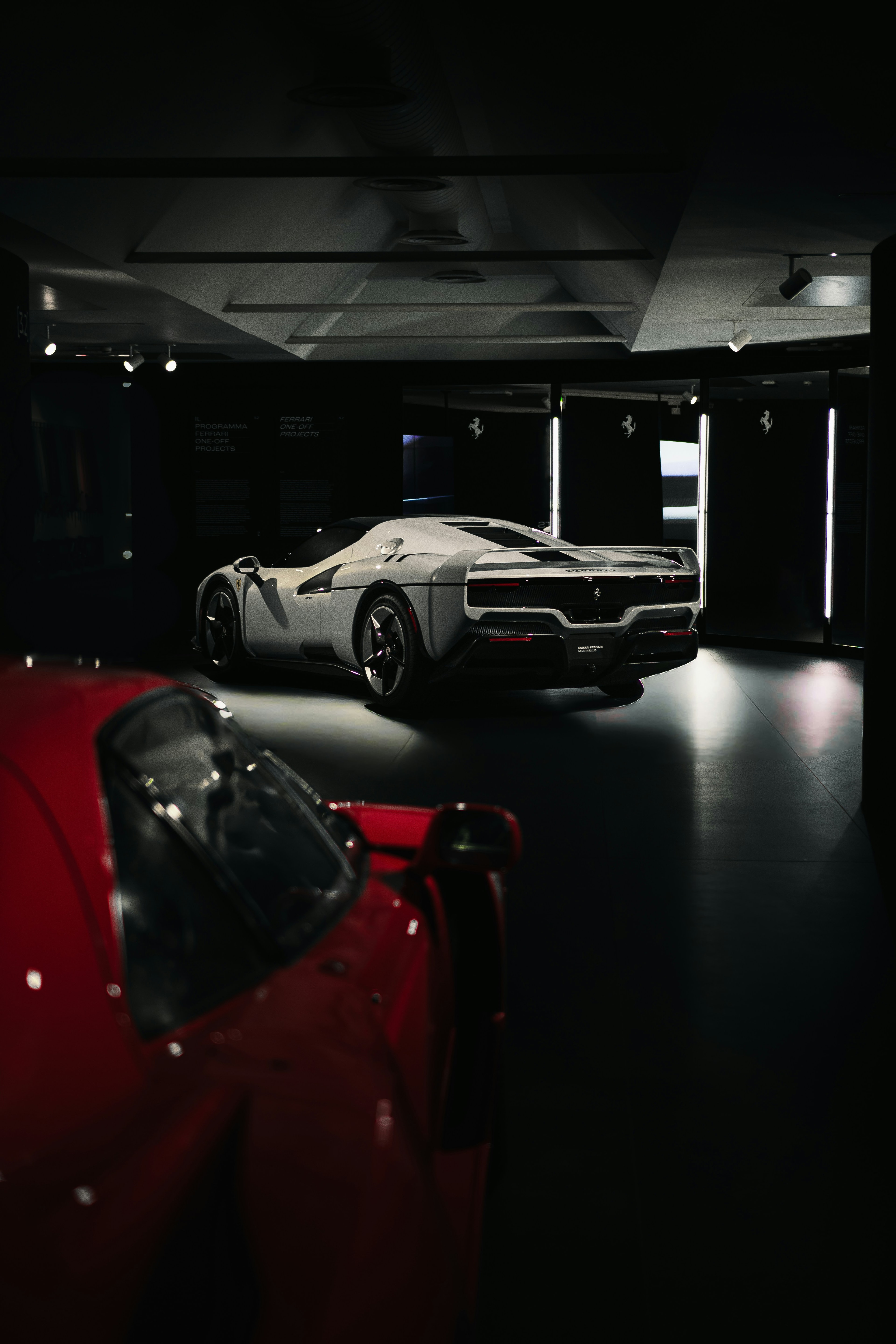 Luxury sports car in minimalist gallery